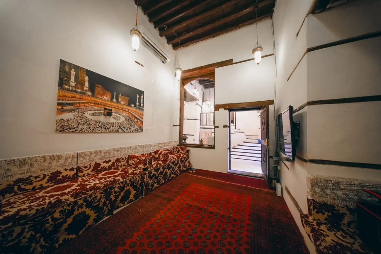 A first-floor hall with heritage seating and framed pictures on the wall