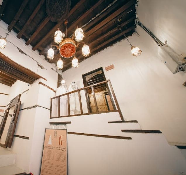 Lanterns hung above the house's wooden staircase
