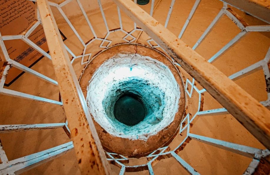 The house's circular light well and wooden balustrade from above